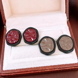 French vintage irregular folded earrings in deep red and taupe with black borders