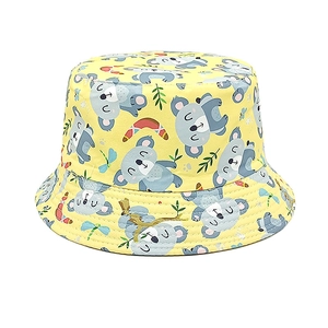 Detail of high-density cotton yellow bucket hat with cute cartoon koala print patterns