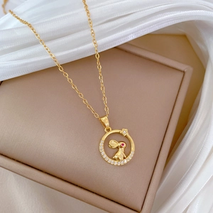 Gold stainless steel necklace featuring a crystal rabbit pendant with red eyes on satin