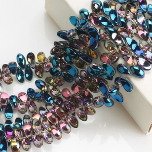 Macro shot of iridescent AB coated teardrop crystal glass beads for jewelry making