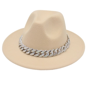 Detail of khaki fedora hat featuring a chunky silver chain with iridescent rhinestones