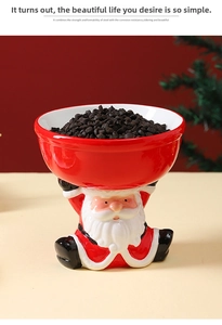 Detail of Santa Claus ceramic pet bowl with red holiday design and raised base