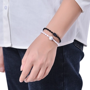 Adjustable woven bracelet with 12mm white turquoise and black magnetic stones for couples