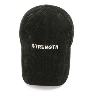 Black corduroy baseball cap with white STRENGTH embroidery in a classic curved brim style