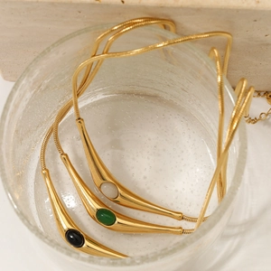 Chic stainless steel snake chain necklace with colorful natural stone pendants on glass