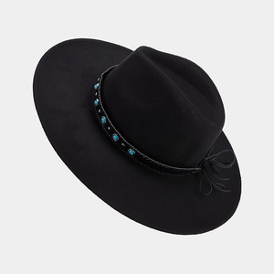 Detail of black wide brim felt hat with turquoise bead trim and delicate bow accent