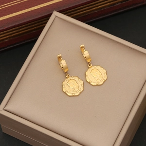 Vintage gold hexagon coin earrings featuring profile relief in a luxury jewelry box