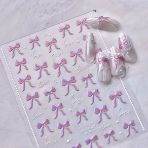 Autocollants nail art nœuds 3D avec dégradé rose et finition nacrée élégante