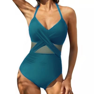 One-piece halter swimsuit with mesh panels and crossover wrap design in peacock blue