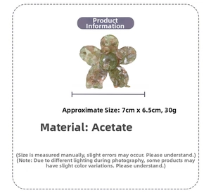 Detail view of acetate flower hair claw clip with dimensions 7cm by 6.5cm and 30g weight