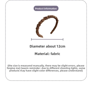 Detail view of brown pleated fabric headband with 12cm diameter measurement scale