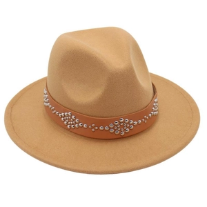 Detail of camel wool fedora hat featuring a brown leather band with silver metal studs