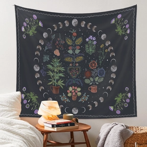 Detail of dark grey bohemian tapestry with lunar phases and botanical floral patterns