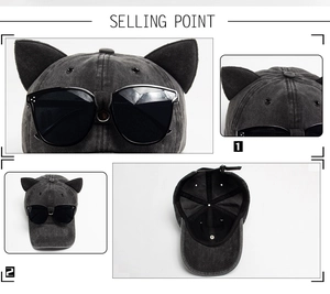 Detail view of washed grey baseball cap with cat ears and integrated black sunglasses