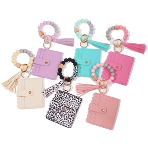 Detail view of food-grade silicone bead wristlet keychains with PU leather card holders