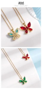 Detailed macro of crystal butterfly pendant necklaces in red blue and green colors