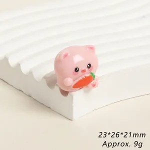 Macro view of cute resin pig figurine holding a carrot, sized 23x26x21mm for DIY crafts