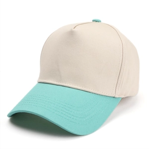 Detail of five-panel baseball cap with cream crown and mint green brim and button