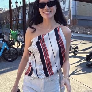 Chic asymmetric striped one-shoulder top with vibrant multi-color vertical patterns