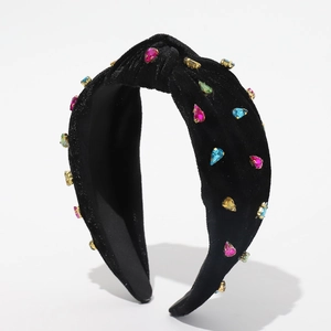 Black velvet knotted headband with multi-colored rhinestones on a clean white background