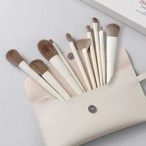 10-piece professional makeup brush set with beige travel pouch and soft gradient bristles