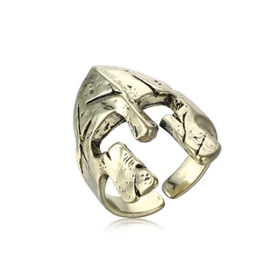 Detail of vintage Spartan helmet ring showing antique gold finish and rustic metal texture