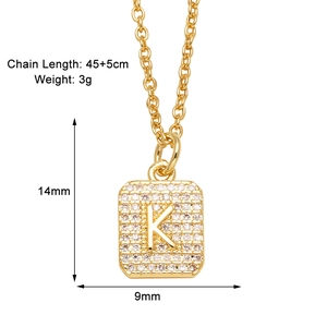 Detail of gold square pendant with cubic zirconia and letter K with dimension markings