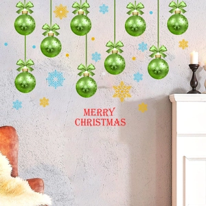 Christmas wall decal with green baubles and snowflakes in a cozy room setting