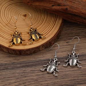 Orecchini pendenti a forma di scarabeo vintage in oro e argento anticato con texture