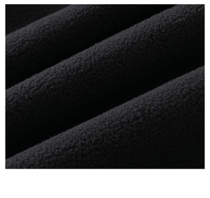 Close-up of thick black double-sided polar fleece fabric with soft dense texture