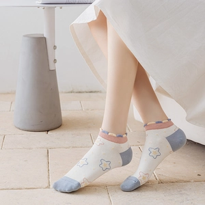 Japanese style white cotton socks with colorful star patterns and wavy ruffle cuffs