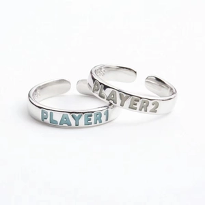 Detail of S925 sterling silver rings with Player 1 and Player 2 glowing engraving