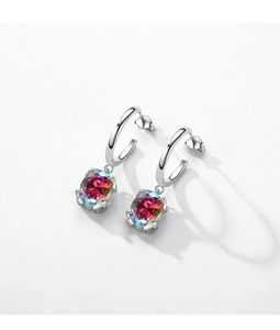 Macro detail of silver sterling hoop earrings with vibrant multicolor gradient zircons