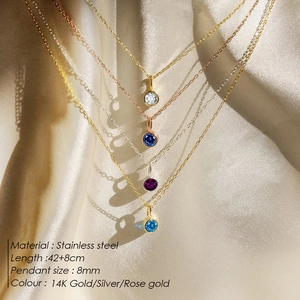 Macro view of 8mm colorful rhinestone pendants on gold and silver stainless steel chains