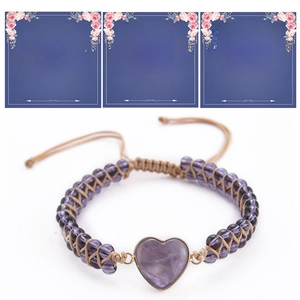 Close-up of handmade purple beaded heart stone bracelet set with greeting cards for gift