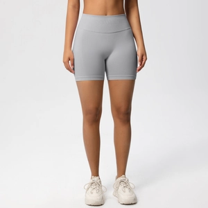 Detailed close-up of seamless high-waist yoga shorts in grey knit fabric for fitness