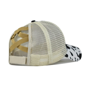 Detail of cross-elastic bands for high ponytail on cow print mesh baseball cap