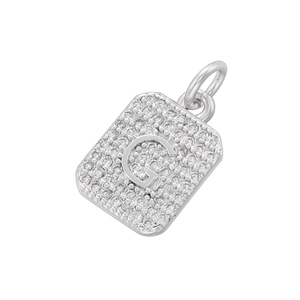 Detailed view of square silver pendant featuring letter G with cubic zirconia stones