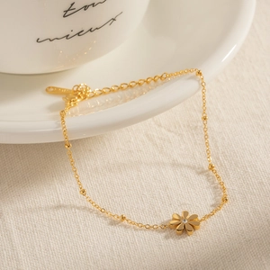 Elegant gold daisy flower bracelet with crystal center on minimalist chain for women