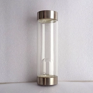 Glas Trinkflasche mit silbernen Metalldeckeln und Innenkammer für Edelsteine