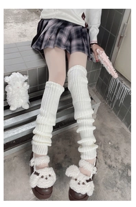Detailed view of white ribbed knit long leg warmers styled with Lolita JK skirt