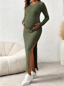 Detail of olive green ribbed knit maternity dress with crew neck and high side slit