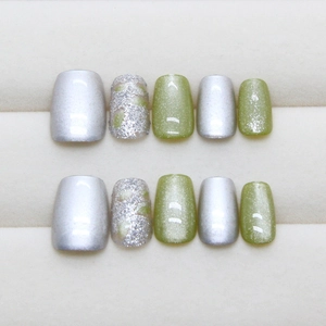 Green cat eye and silver glitter press-on nails set with moss green speckled art design