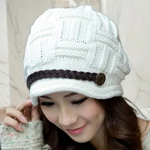 Fashionable beige chunky knit beanie with leather braided band and vintage button accent