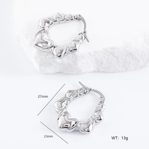 Detailed view of silver heart-shaped hoop earrings with size 27mm and weight 13g specs