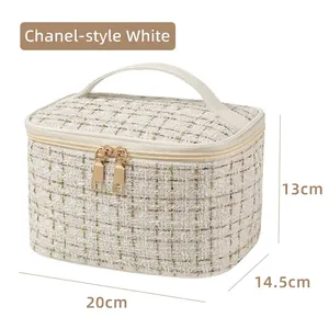 White tweed makeup bag with light gold hardware, measures 20cm x 14.5cm x 13cm