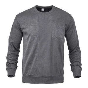 Detail of grey corduroy paneling and pocket on men's crewneck long sleeve sweatshirt
