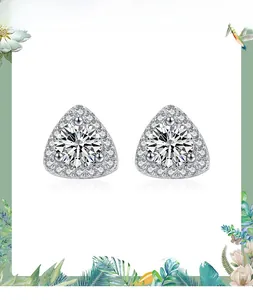 Macro view of sterling silver triangle halo stud earrings with brilliant round center stone