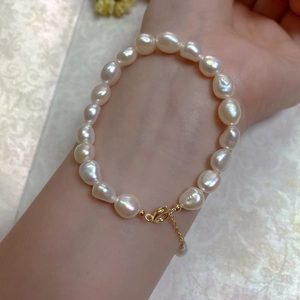 Close-up of Baroque freshwater pearl bracelet with 14K gold-filled clasp on wrist