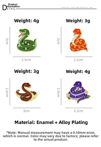 Detailed grid of 2025 snake enamel brooches showing four colorful cartoon designs